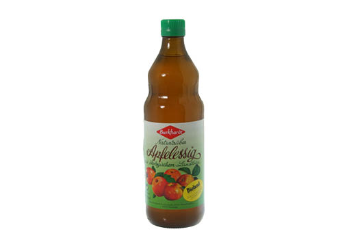 Braune Flasche mit grünem Deckel und buntem Etikette mit der Aufschrift Apfelessig.